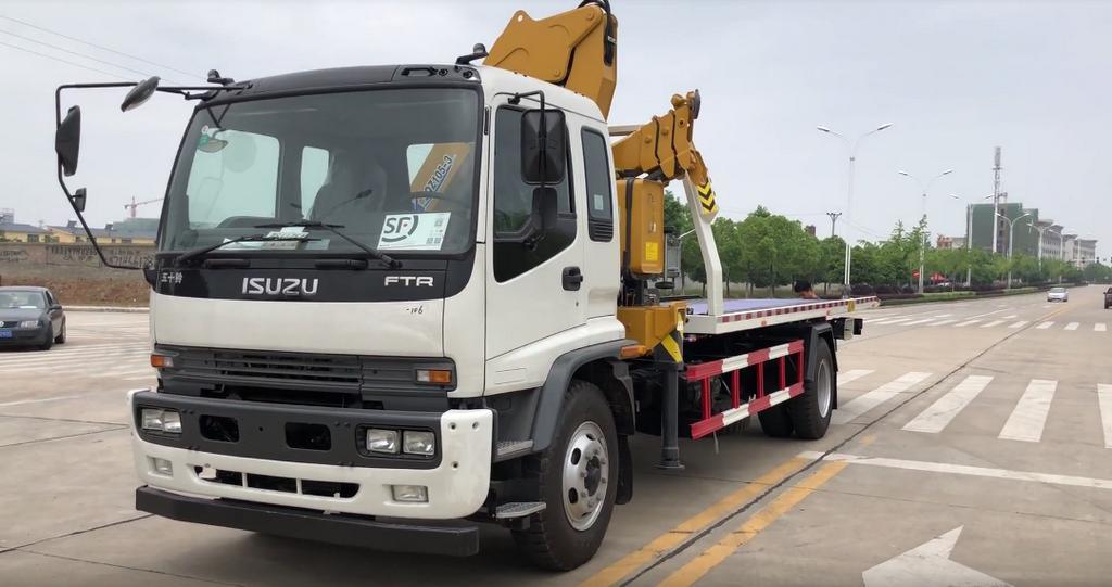 Japan. Brand I. S. U. Z. U Recovery Truck Mounted with Knuckle 5 Ton Crane and Roll Back Flatbed Wrecker Euro 5.6. Engine