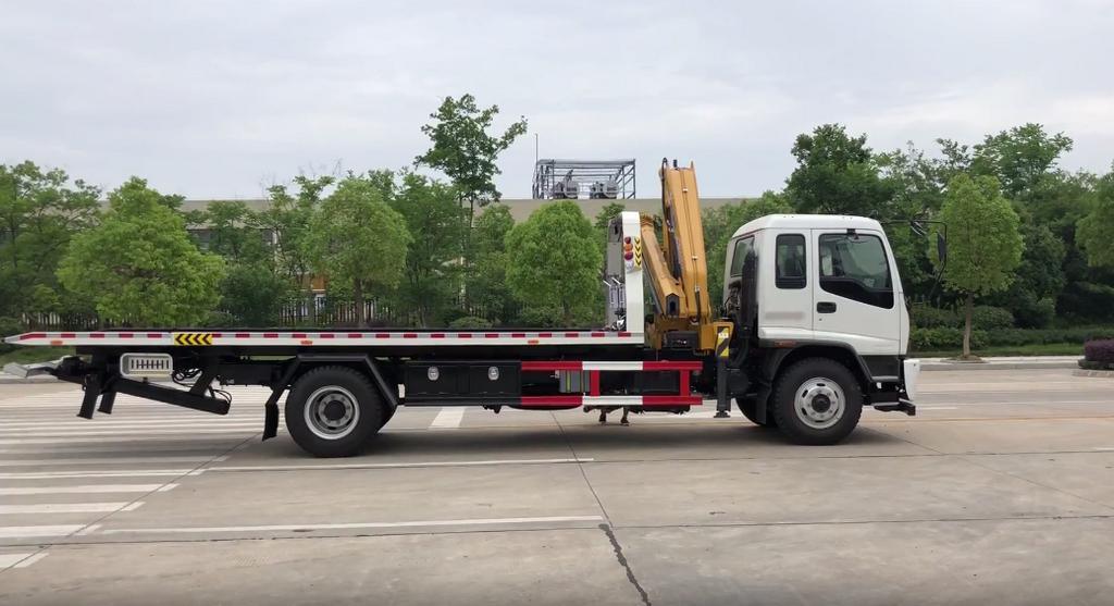 Japan. Brand I. S. U. Z. U Recovery Truck Mounted with Knuckle 5 Ton Crane and Roll Back Flatbed Wrecker Euro 5.6. Engine